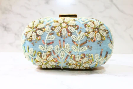 Blue Capsule embroidered clutch