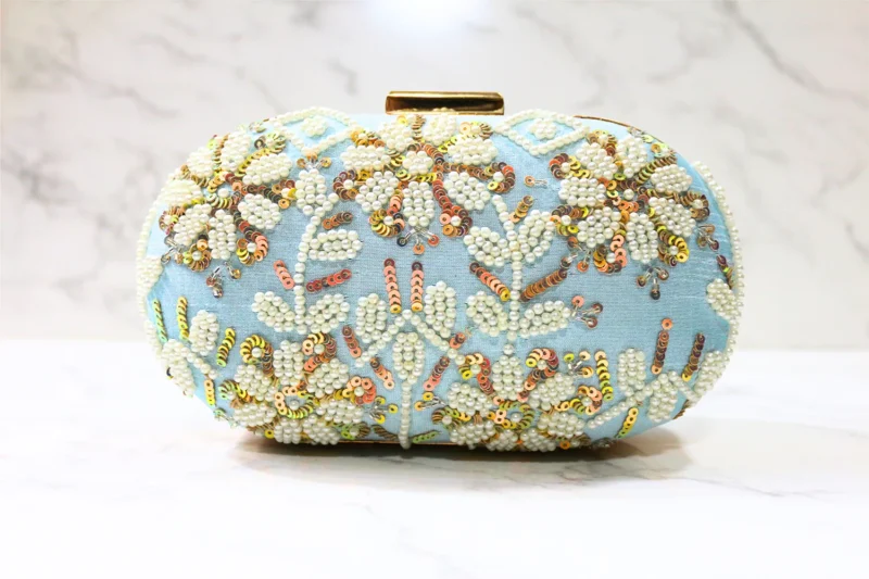 Blue Capsule embroidered clutch