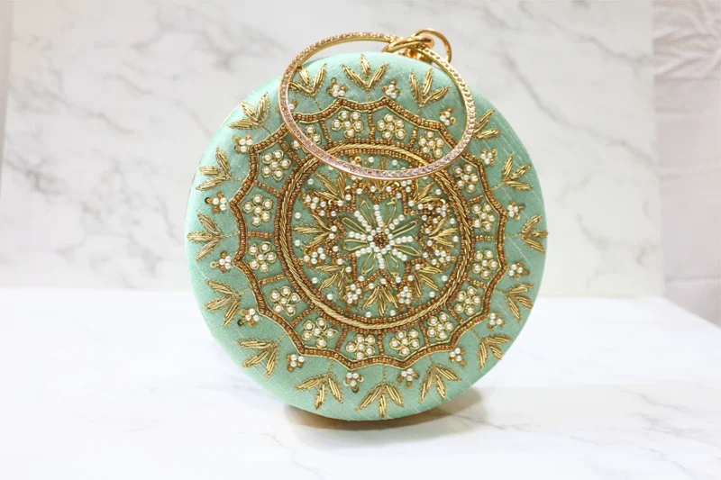 Green Round emroidered clutch with bangle